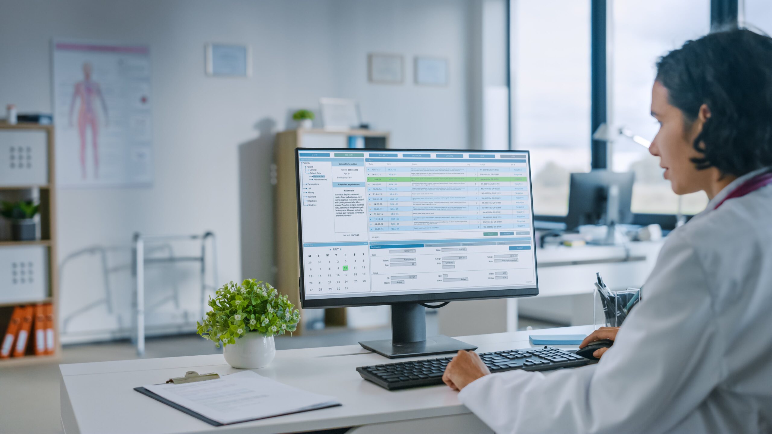 Doctor in a white coat on her PC uses bandwith-intensive apps reliably via secure, HIPAA-compliant Kinetic Business internet