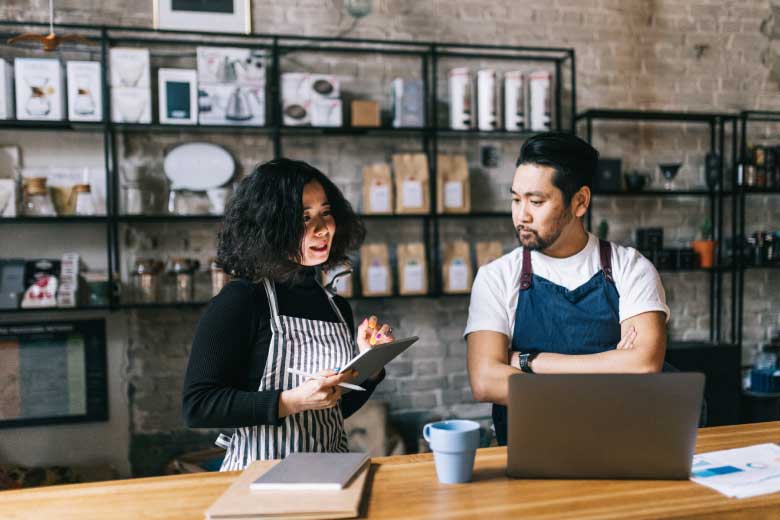 Small craft coffee business owner and employee rely on easy to use, reliable internet service by Kinetic Business.